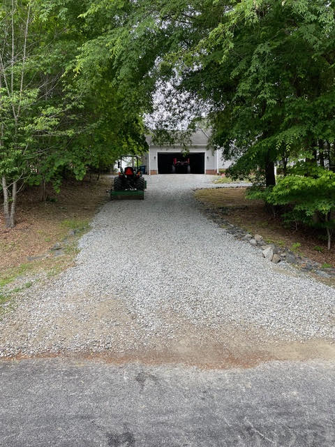 New gravel driveway leading to the garage